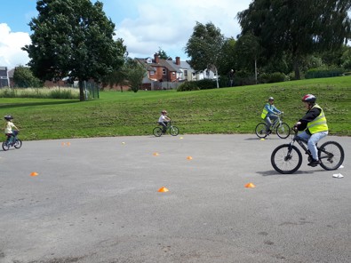 Picture of people on bicycles at a training session